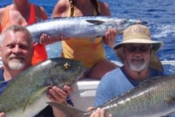 a person holding a fish in the water