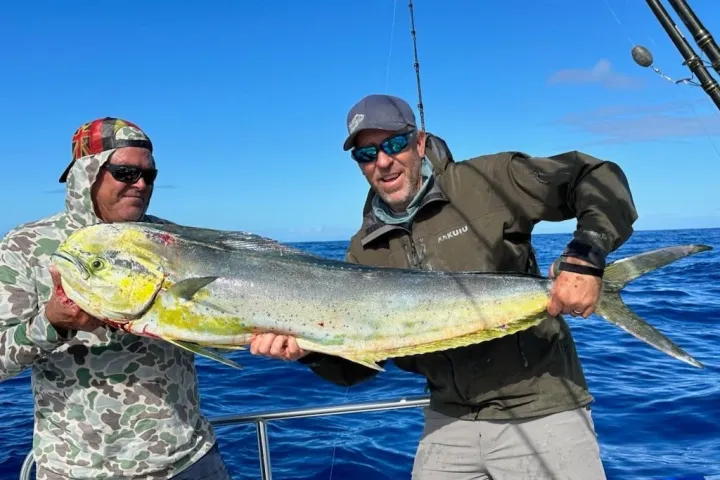 a man holding a fish