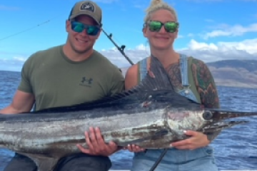 a person holding a fish