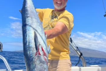 a man holding a fish