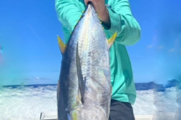 a person holding a fish