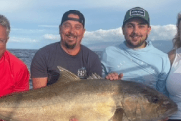 a man holding a fish