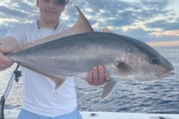 a man holding a fish