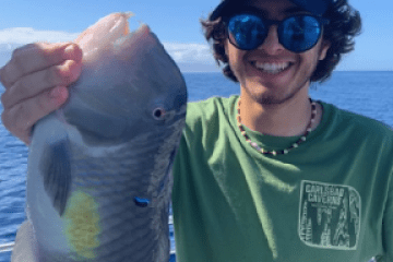 a person holding a fish